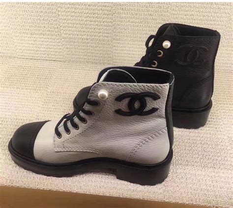 black and white chanel boots|Chanel black canvas heel boots.